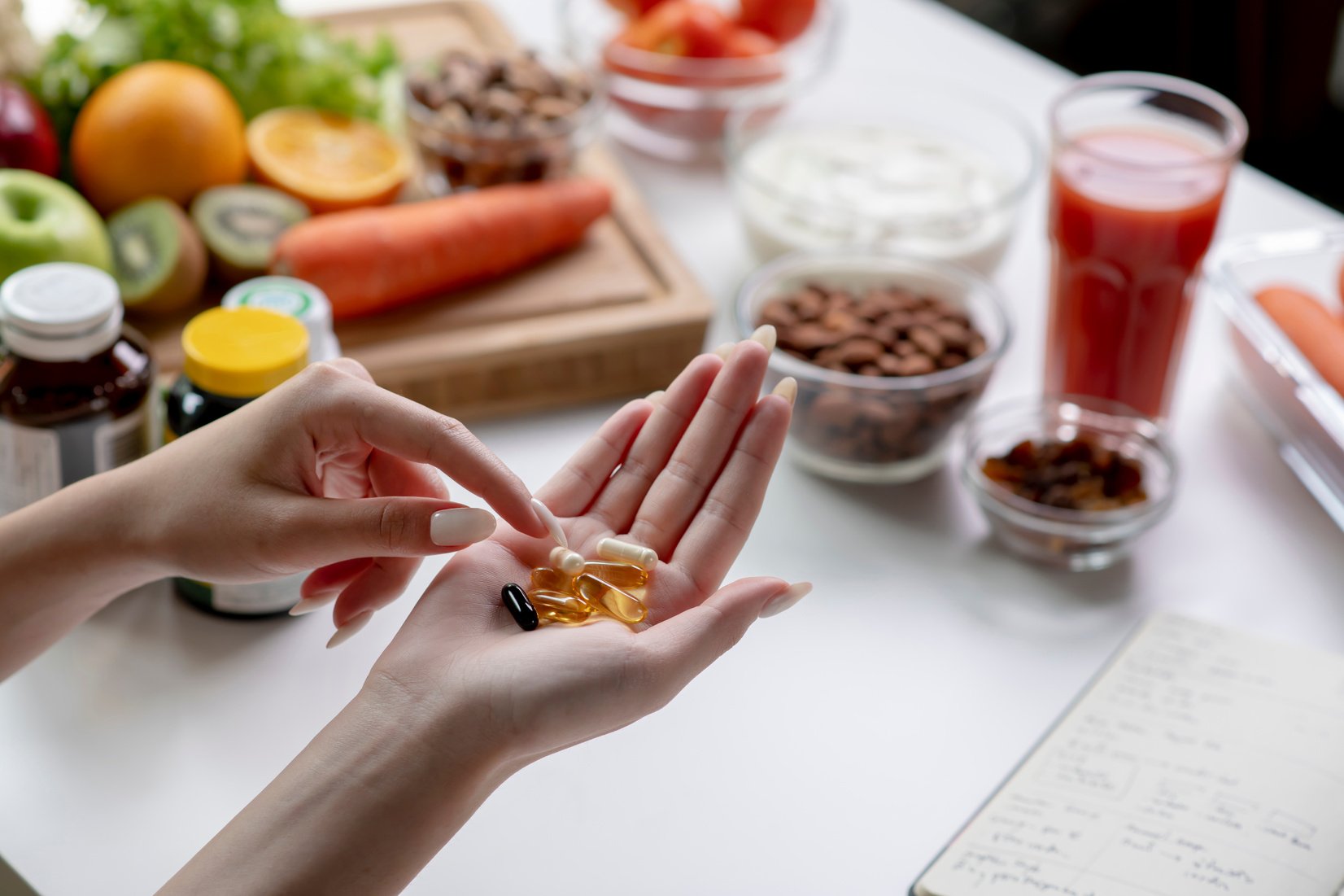 Nutritionist checking dietary supplements in hand