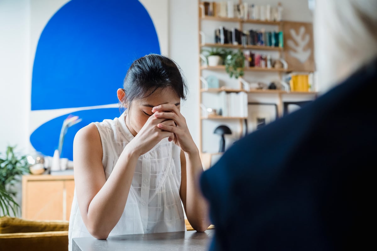 Worried Woman during Session with Therapist